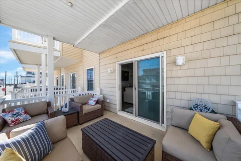 a living room with furniture and a rug