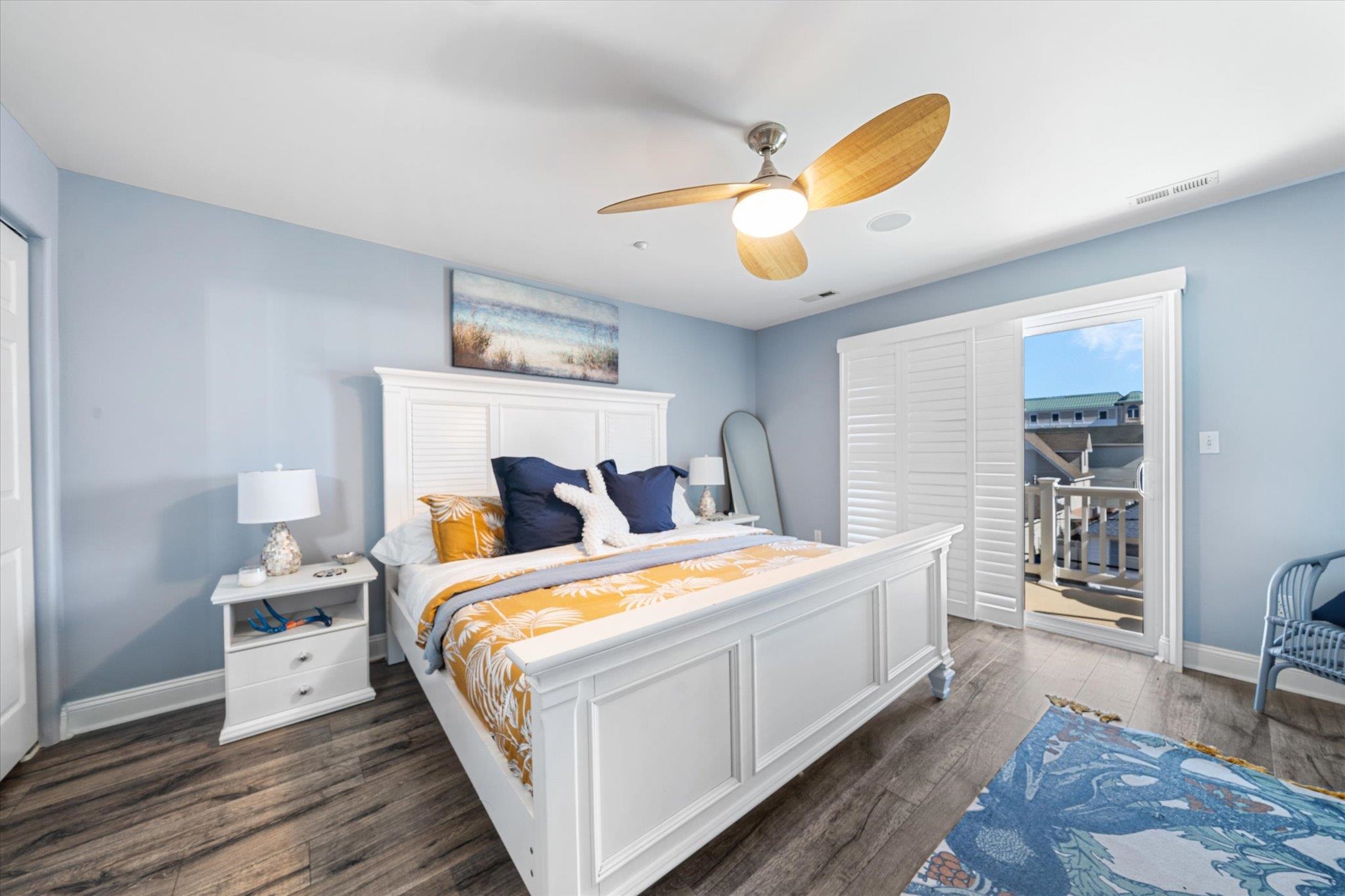 110 West Walnut Avenue, Unit 103 North Wildwood, NJ 08260 - Photo 31 of 44 a bed room with a bed and a chandelier