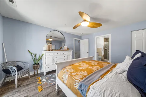 a bedroom with a bed and a dresser