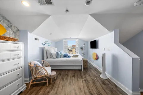 a room with furniture and a wooden floor