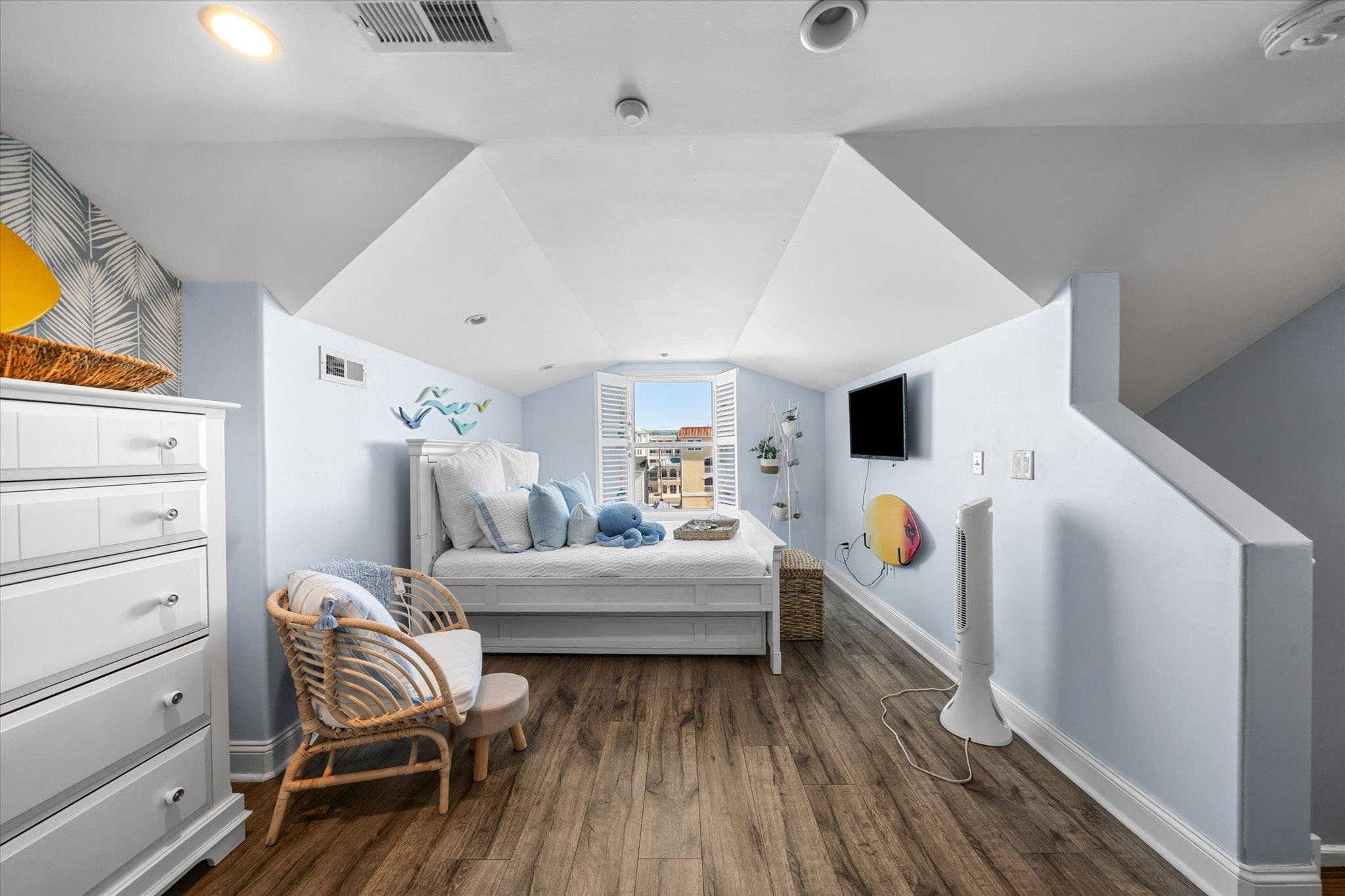 110 West Walnut Avenue, Unit 103 North Wildwood, NJ 08260 - Photo 39 of 44 a room with furniture and a wooden floor