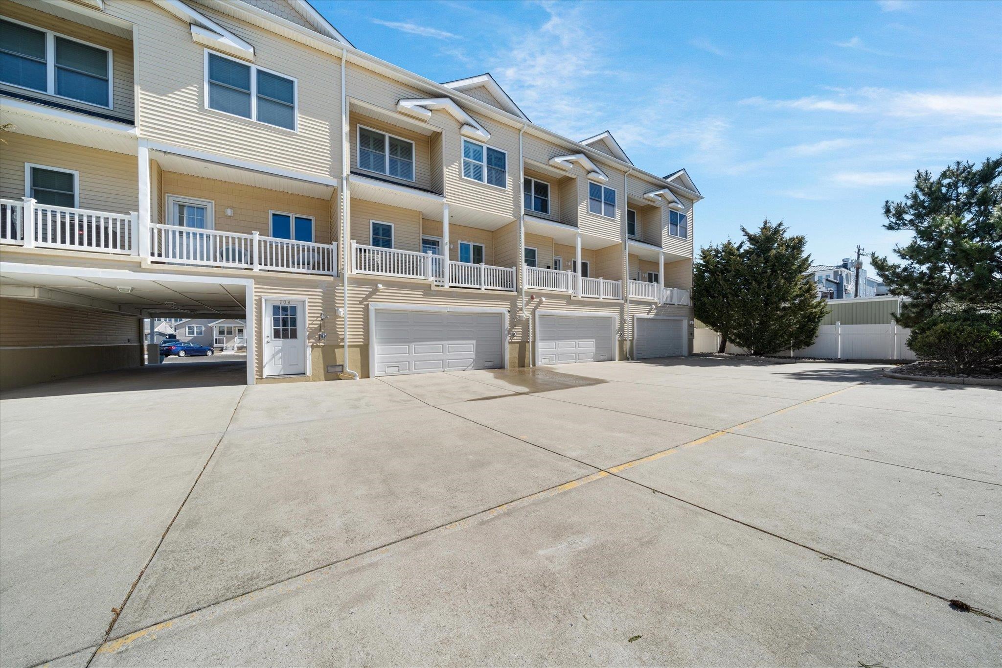 110 West Walnut Avenue, Unit 103 North Wildwood, NJ 08260 - Photo 42 of 44 a front view of a building with many windows