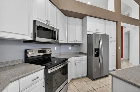 a bathroom with a bathtub sink and mirror