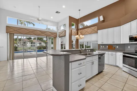 a bathroom with a sink a mirror and a shower