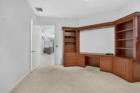 a view of a building with potted plants