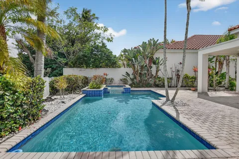 a kitchen with a table and chairs in it