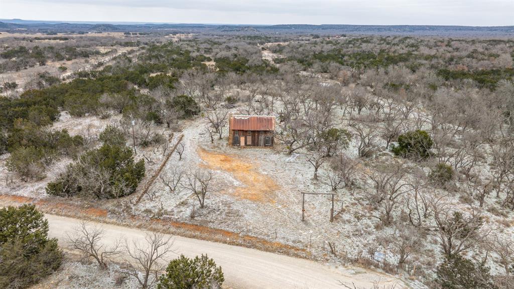 14459 County Road 107 Mingus, TX 76463 - Photo 2 of 40 a view of a dry yard with trees