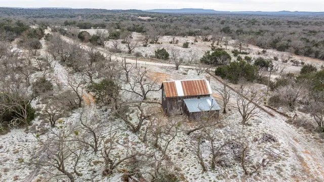 a view of a lake and trees all around