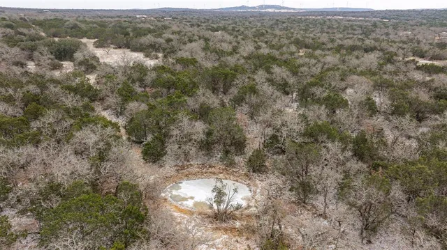 a view of a yard with a mountain