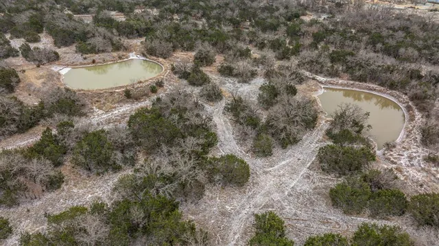 a view of white house with a yard and mountain view