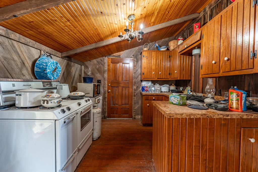 14459 County Road 107 Mingus, TX 76463 - Photo 10 of 40 a kitchen with stainless steel appliances granite countertop a stove sink and cabinets