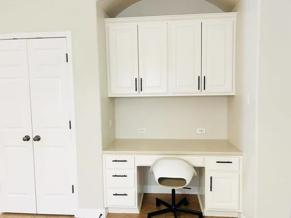 a view of cabinets with washer and dryer