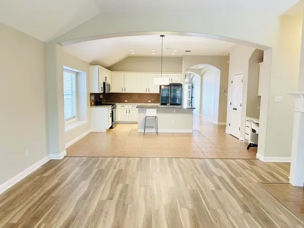 a view of kitchen with sink and window