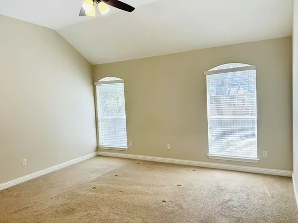 an empty room with windows