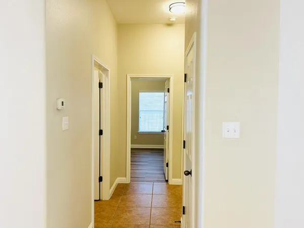 a view of a bathroom from a hallway