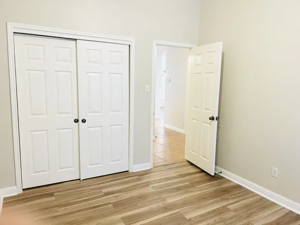 a view of a livingroom with wooden floor