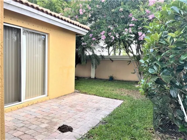 a backyard of a house with lots of green space