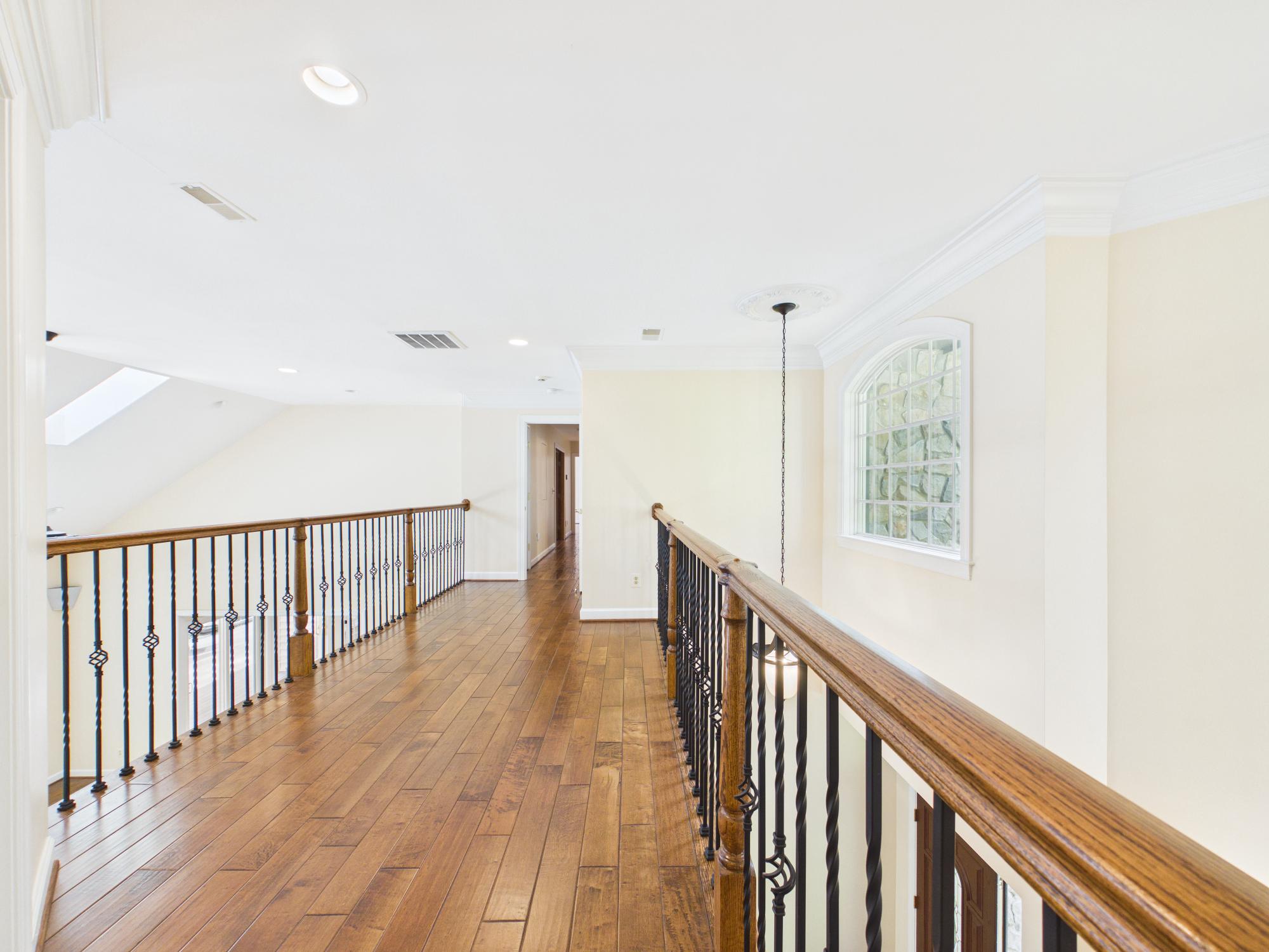 7972 Pinnacle Ridge Drive Manassas, VA 20112 - Photo 30 of 50 Upper level hallway with elegant railings.