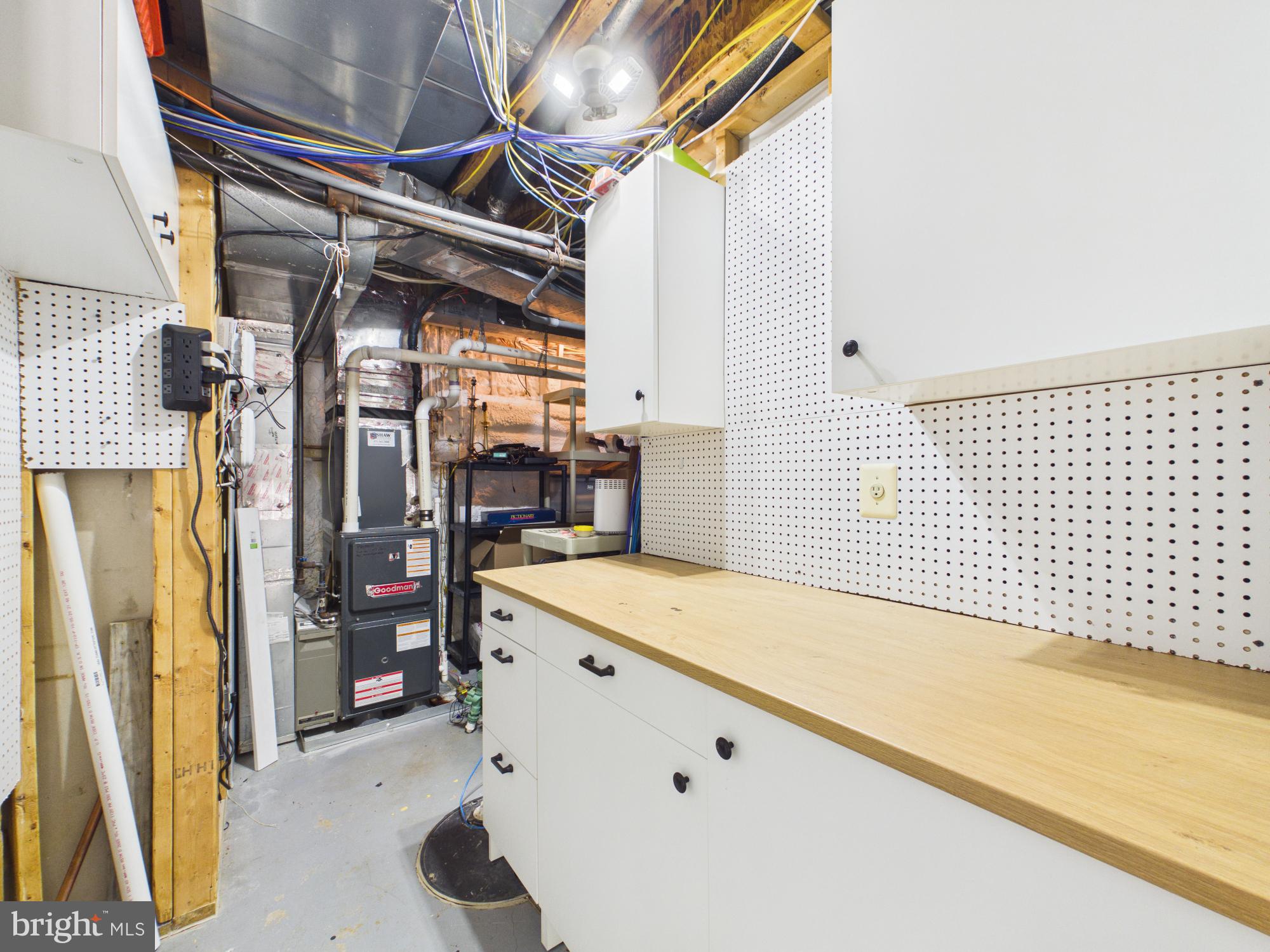 7972 Pinnacle Ridge Drive Manassas, VA 20112 - Photo 35 of 50 Functional basement workspace with storage.
