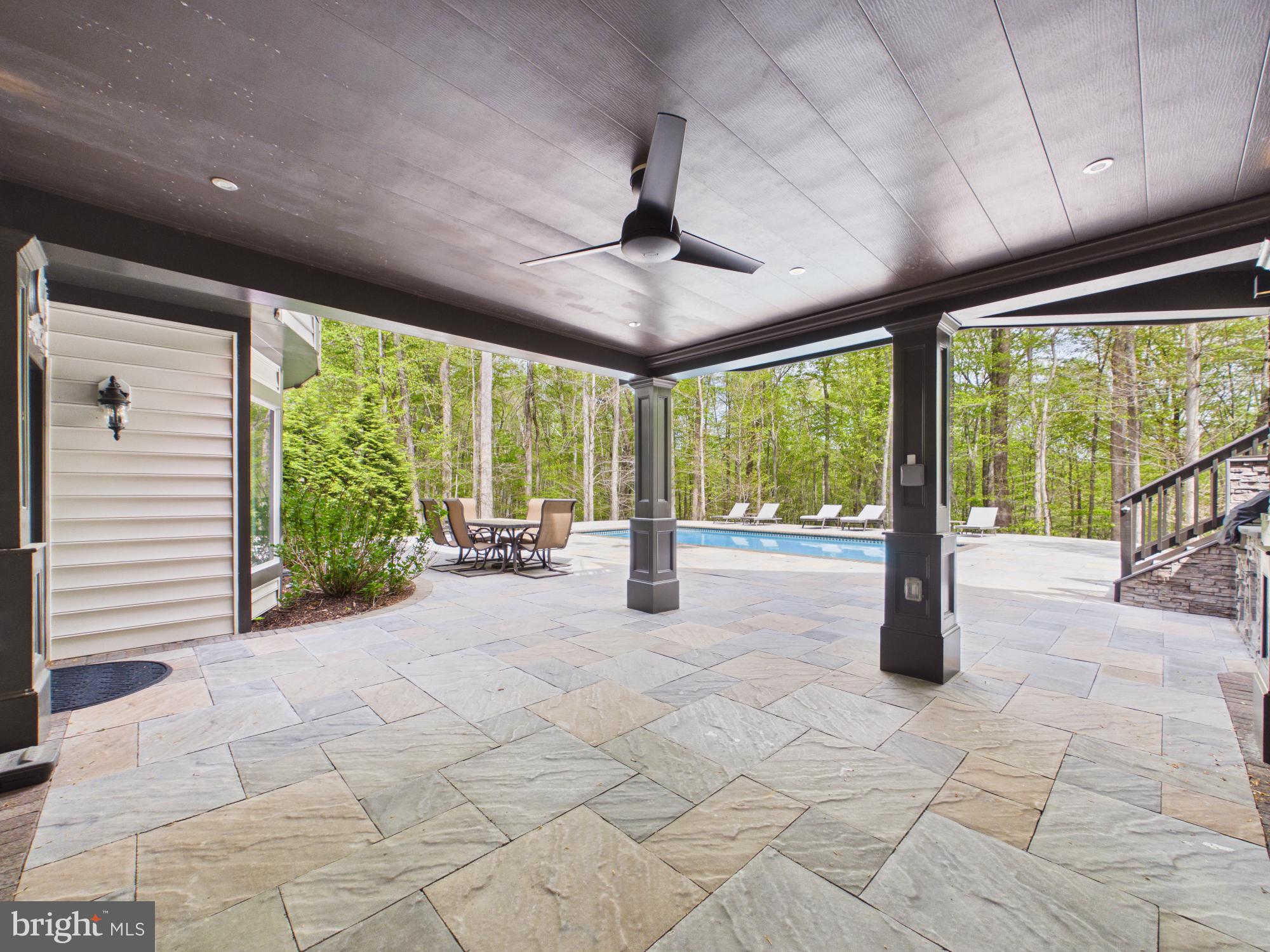 7972 Pinnacle Ridge Drive Manassas, VA 20112 - Photo 49 of 50 Serene outdoor retreat with pool view.