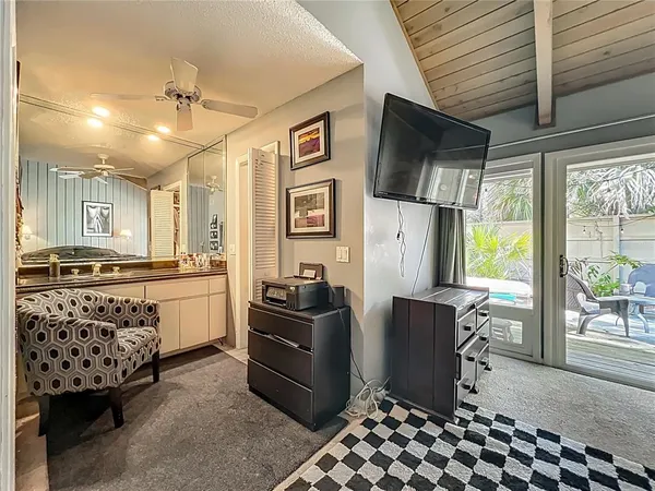 a kitchen with stainless steel appliances kitchen island granite countertop a refrigerator and a stove top oven