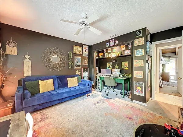 a room with furniture and a flat screen tv