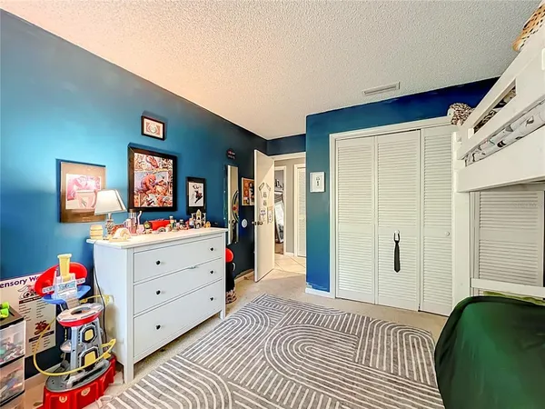 a bedroom with furniture and a bed
