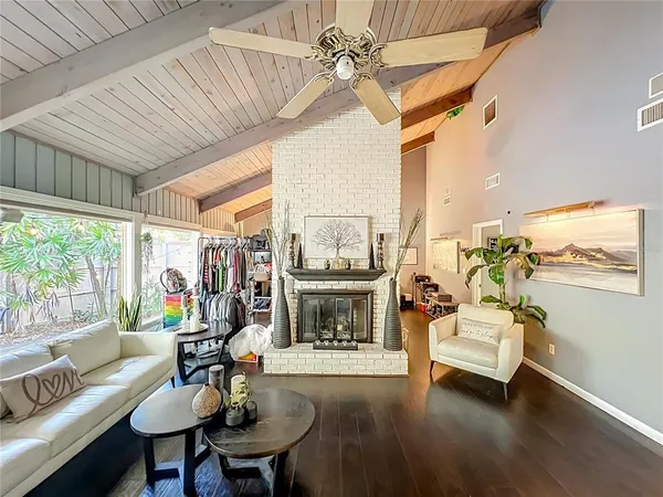a living room with furniture and a fireplace