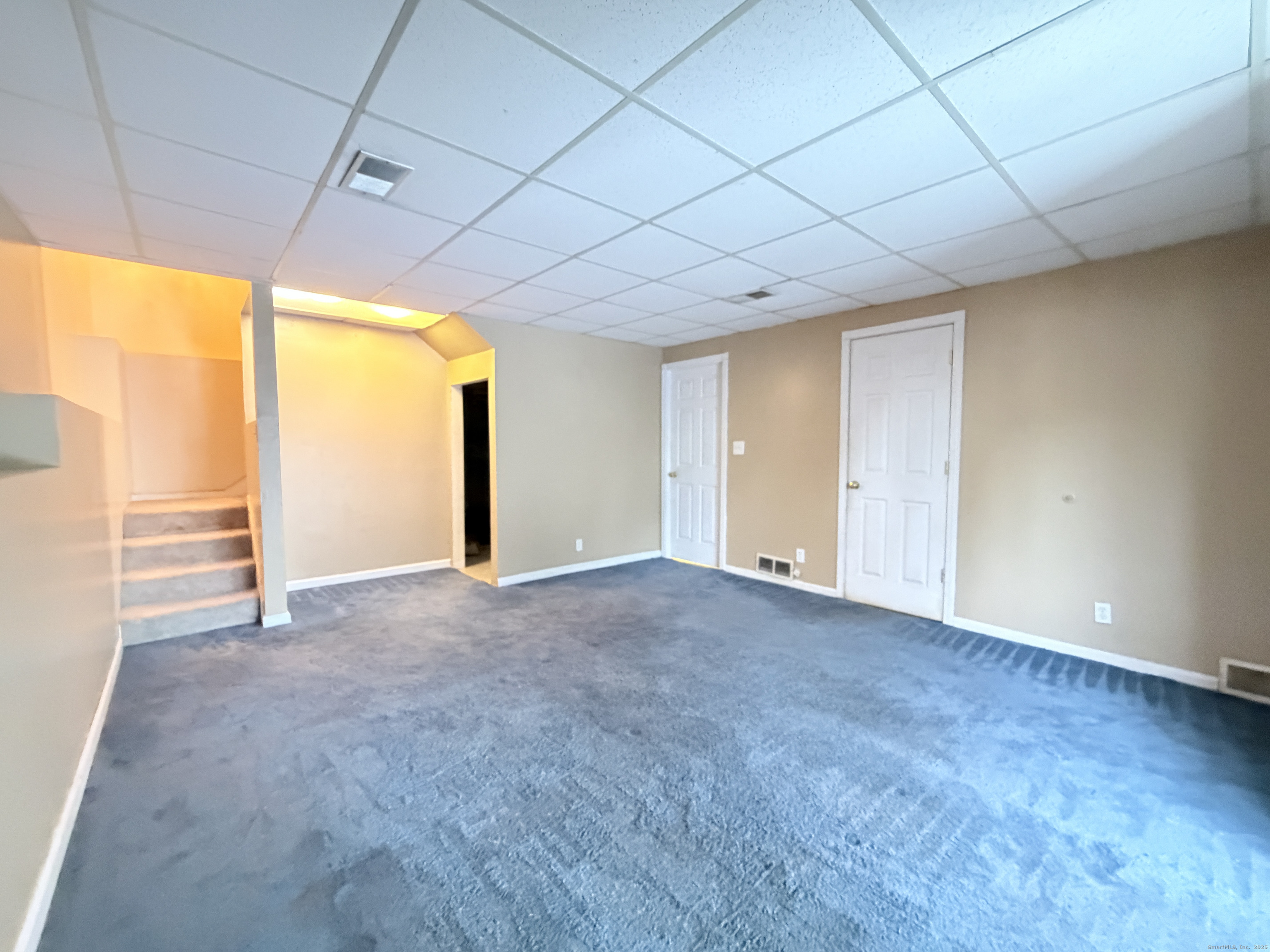 105 Spring Lane, Unit 105 Suffield, CT 06078 - Photo 11 of 16 a view of empty room with wooden floor