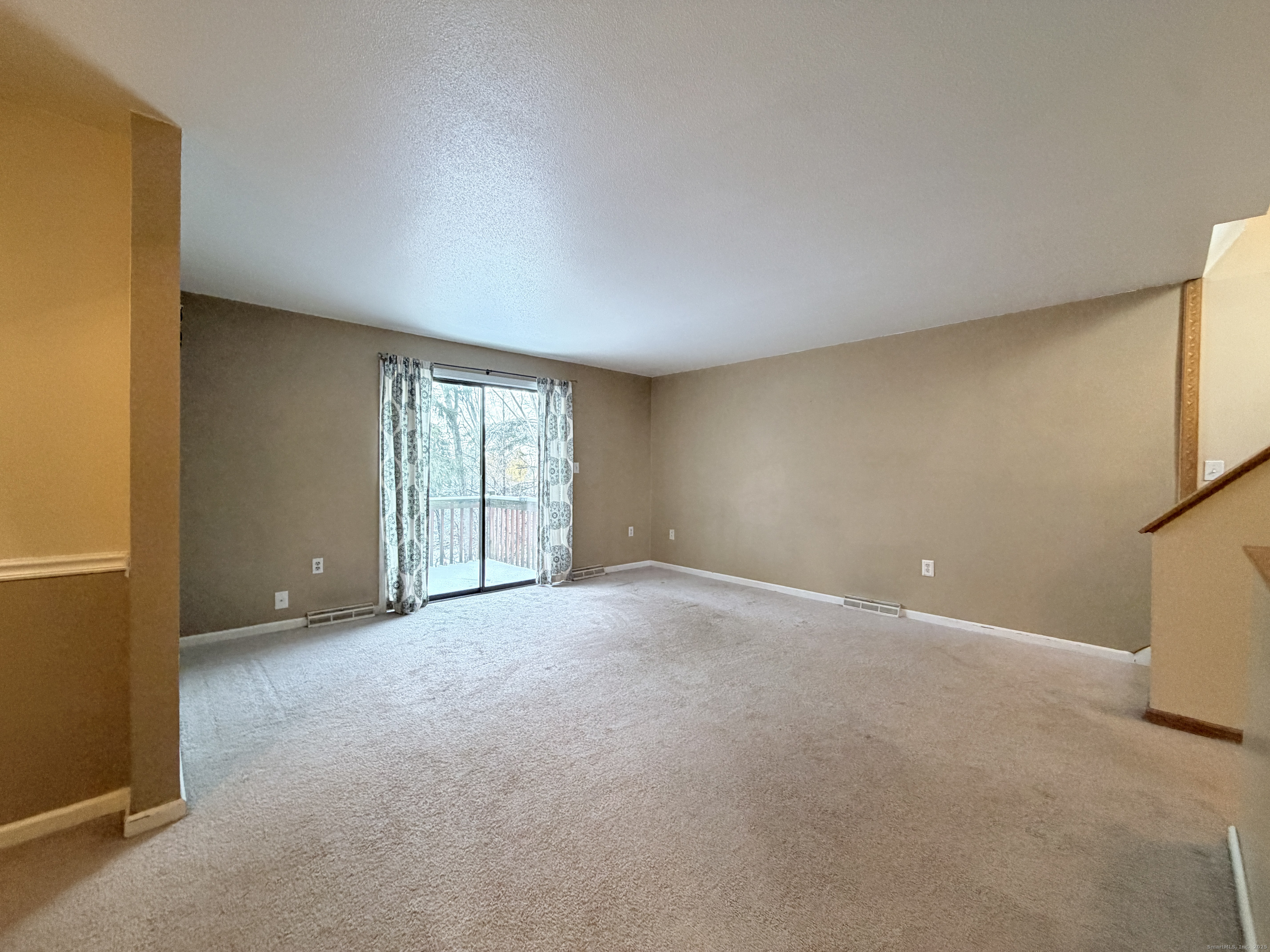105 Spring Lane, Unit 105 Suffield, CT 06078 - Photo 5 of 16 a view of an empty room with a window