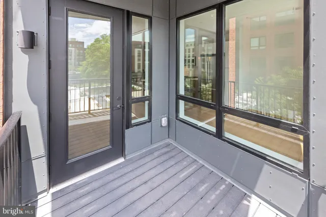 a view of an entryway with wooden floor