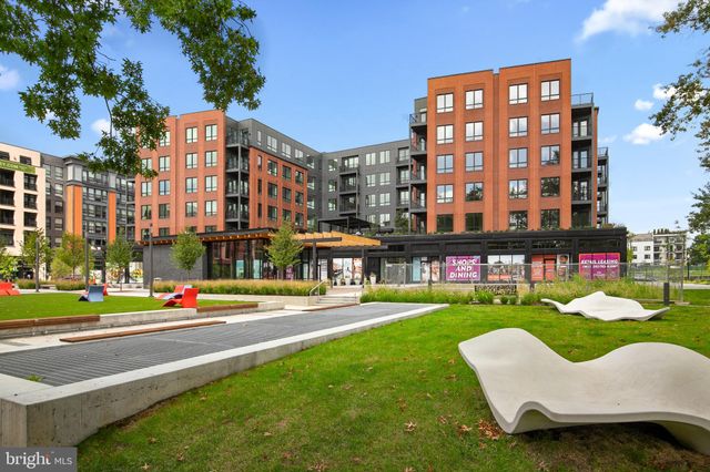 a view of a patio with table and chairs and potted plants
