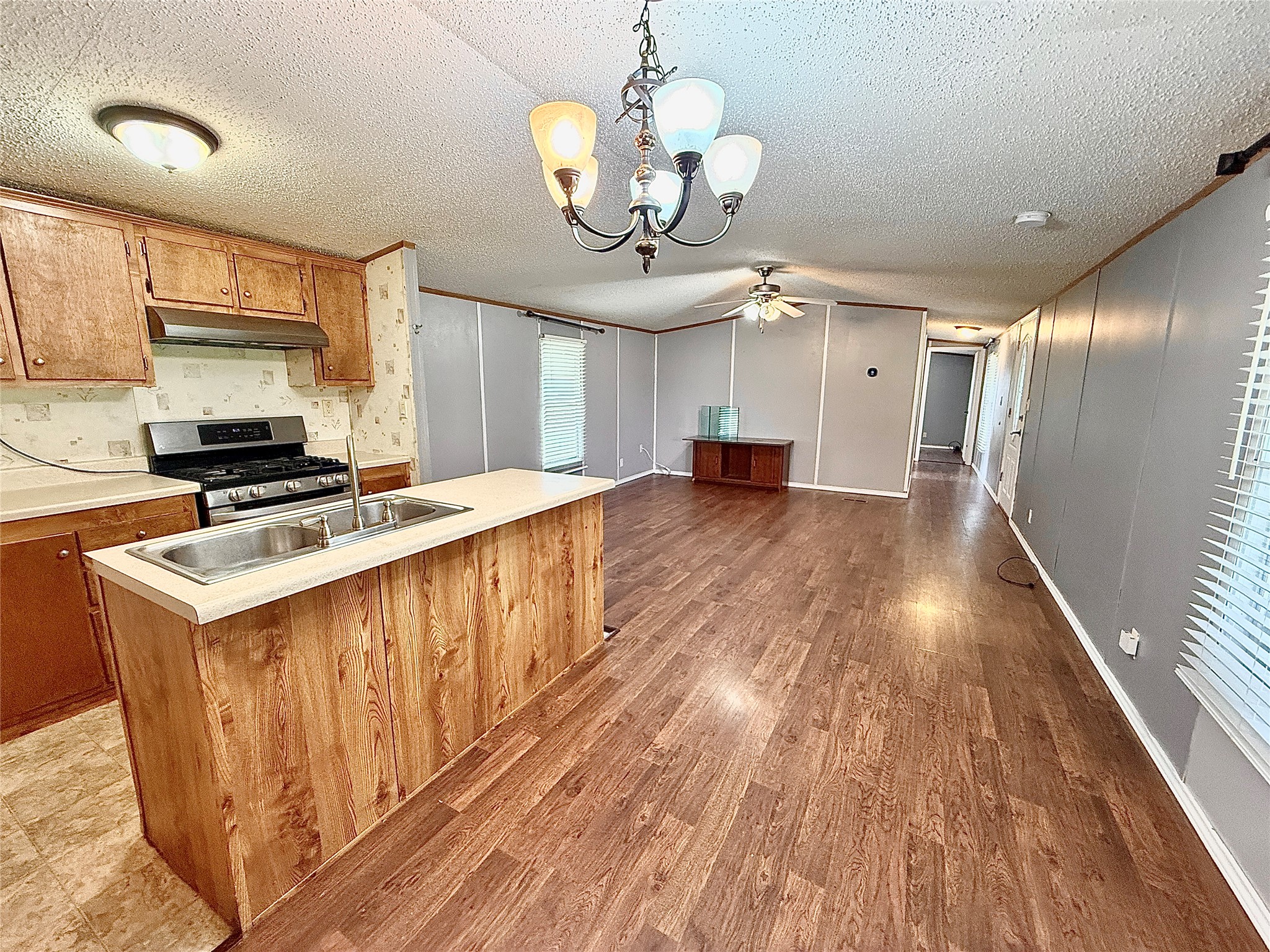 3075 FM 2001 Buda, TX 78610 - Photo 3 of 26 A functional kitchen with a kitchen island overlooking and open to the living area.