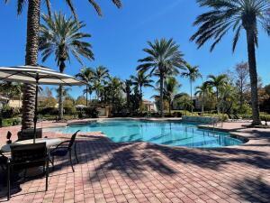 3690 Northwest Mediterranean Lane, Unit 305 Jensen Beach, FL 34957 - Photo 2 of 12 Portofino pool