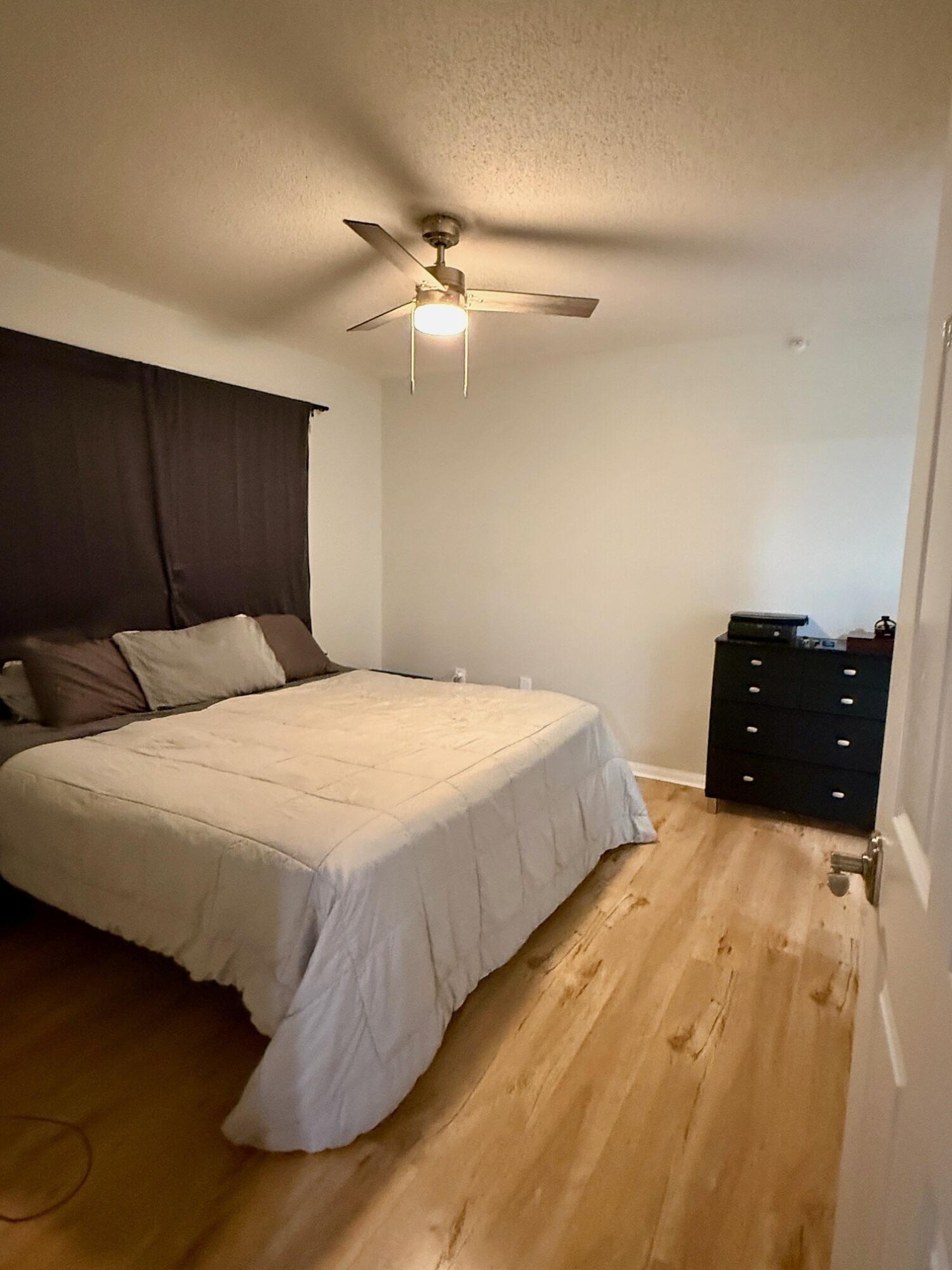 3690 Northwest Mediterranean Lane, Unit 305 Jensen Beach, FL 34957 - Photo 5 of 12 Portofino primary bedroom