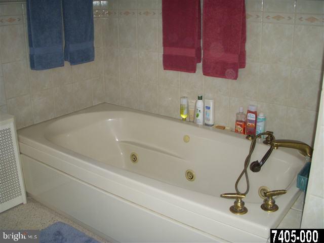 1841 Jefferson Road Spring Grove, PA 17362 - Photo 12 of 16 a bath tub sitting next to a bathroom sink