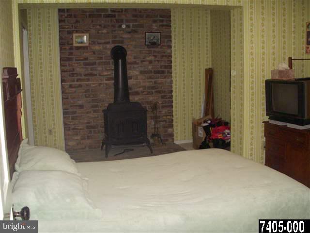 1841 Jefferson Road Spring Grove, PA 17362 - Photo 10 of 16 a bedroom with a bed and a television