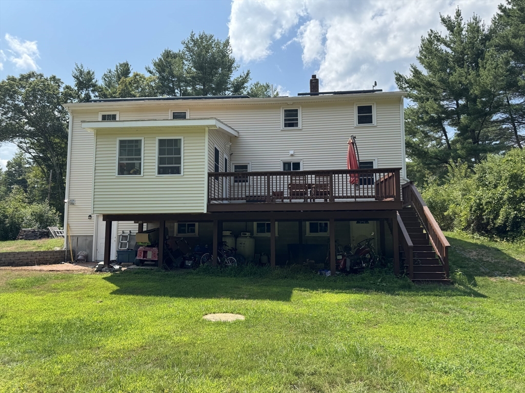 8 Heritage Road, Unit 1 Pelham, NH 03076 - Photo 13 of 13 a view of a house with backyard and sitting area