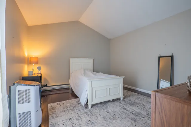 a bedroom with a bed and a cabinets