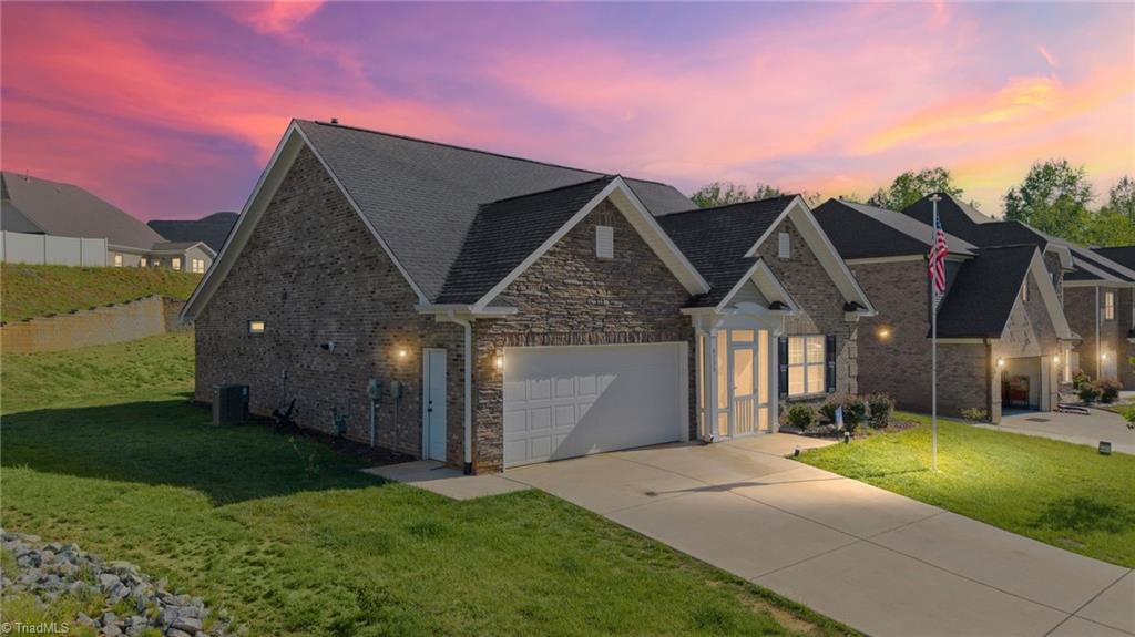 6235 Kershaw Mdws Road Pfafftown, NC 27040 - Photo 2 of 19 Front exterior - virtually enhanced twilight photo