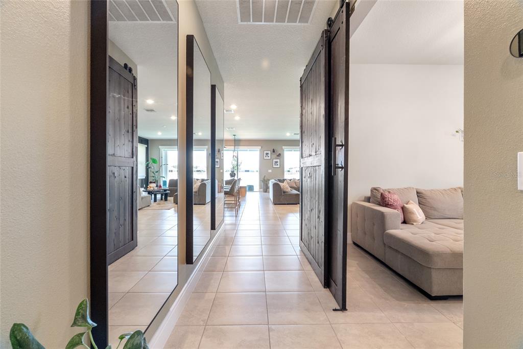 1634 Groveline Road St. Cloud, FL 34771 - Photo 19 of 43 a hallway with furniture and view of living room