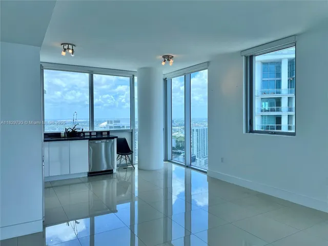 a view of a living room and dining room