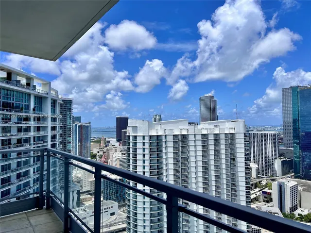 a view of a balcony with a city view