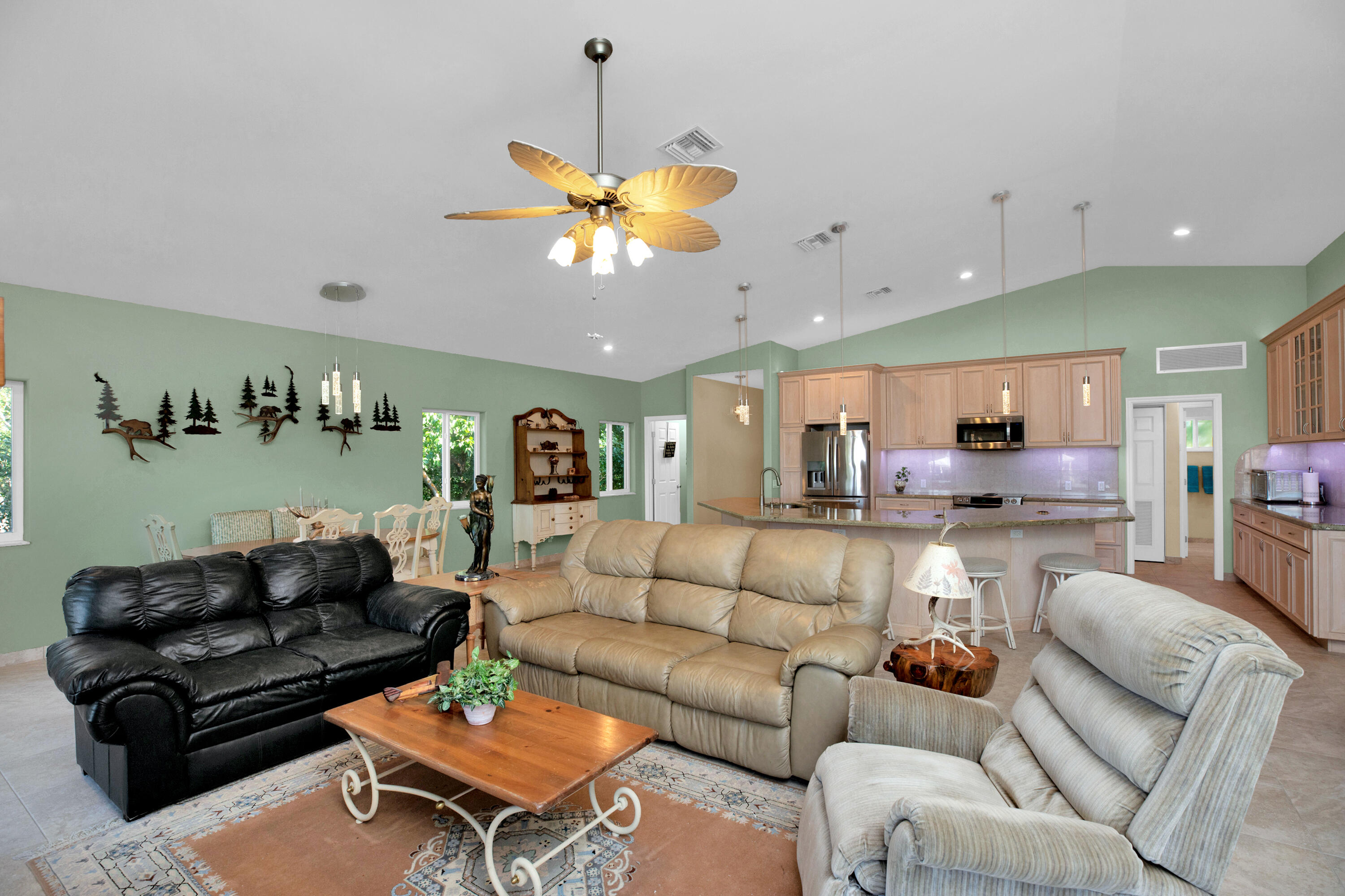 100 South Airport Road Tavernier, FL 33070 - Photo 12 of 42 a living room with furniture kitchen view and a chandelier