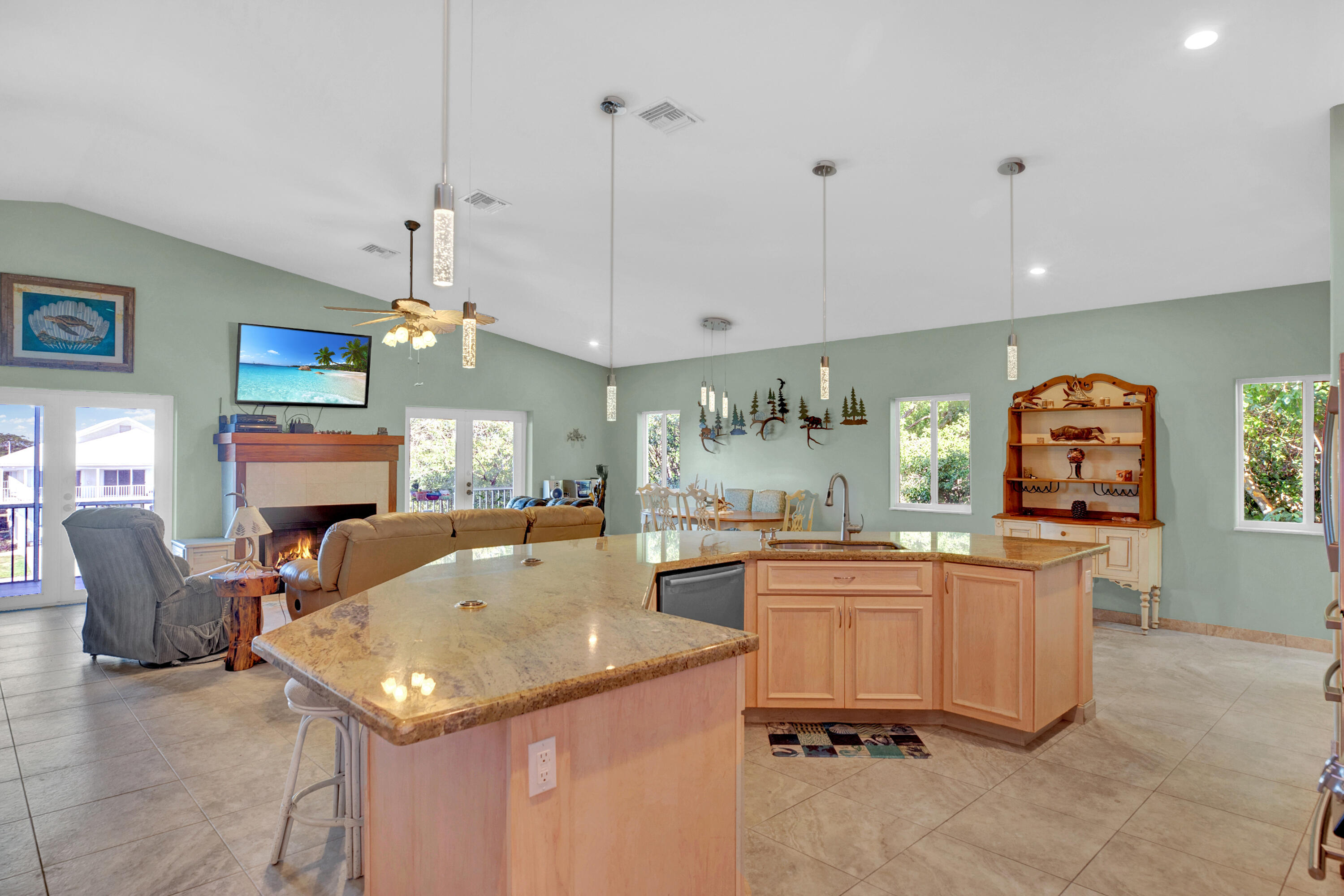 100 South Airport Road Tavernier, FL 33070 - Photo 15 of 42 a kitchen with sink and refrigerator