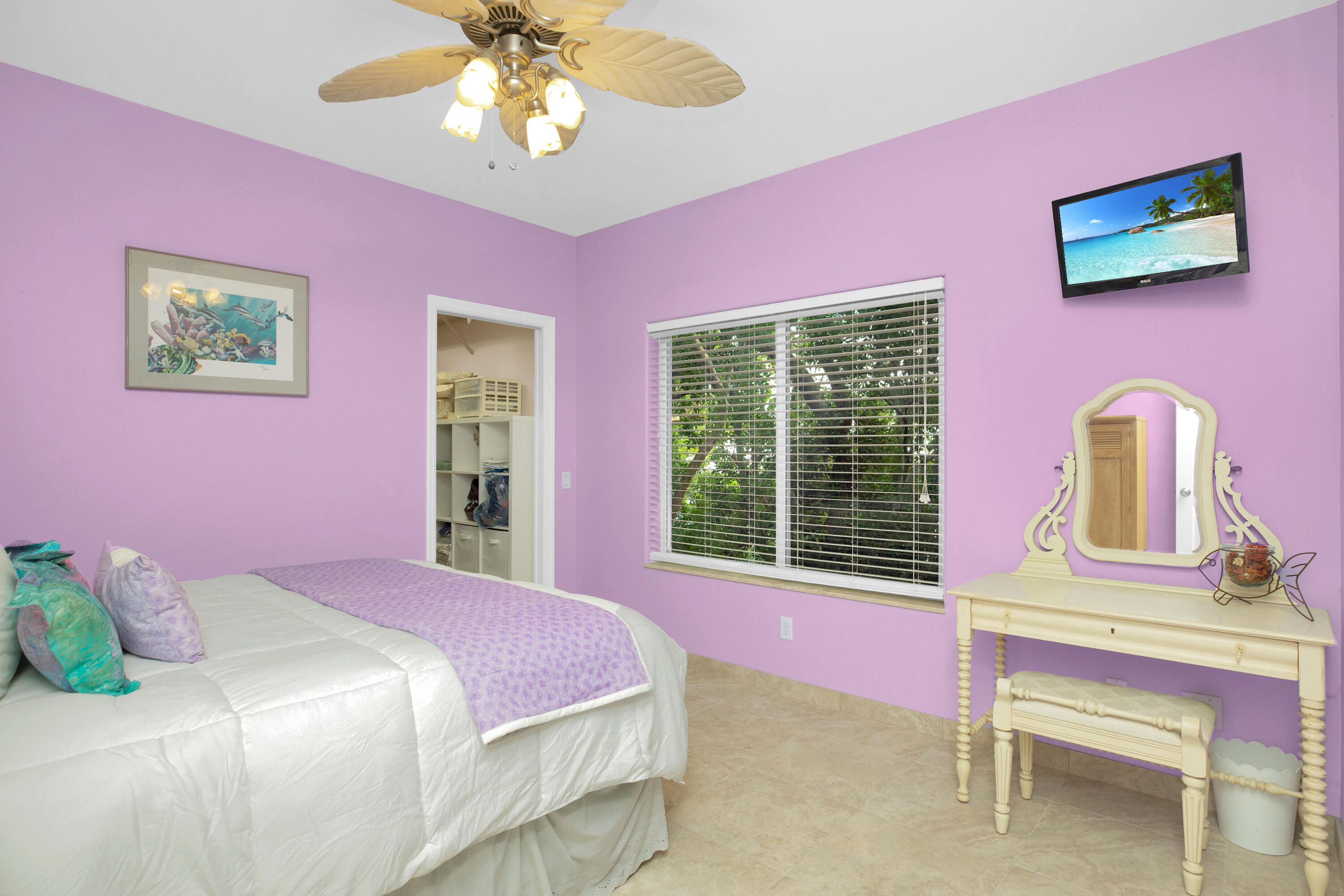 100 South Airport Road Tavernier, FL 33070 - Photo 24 of 42 a bedroom with a bed dresser and a window