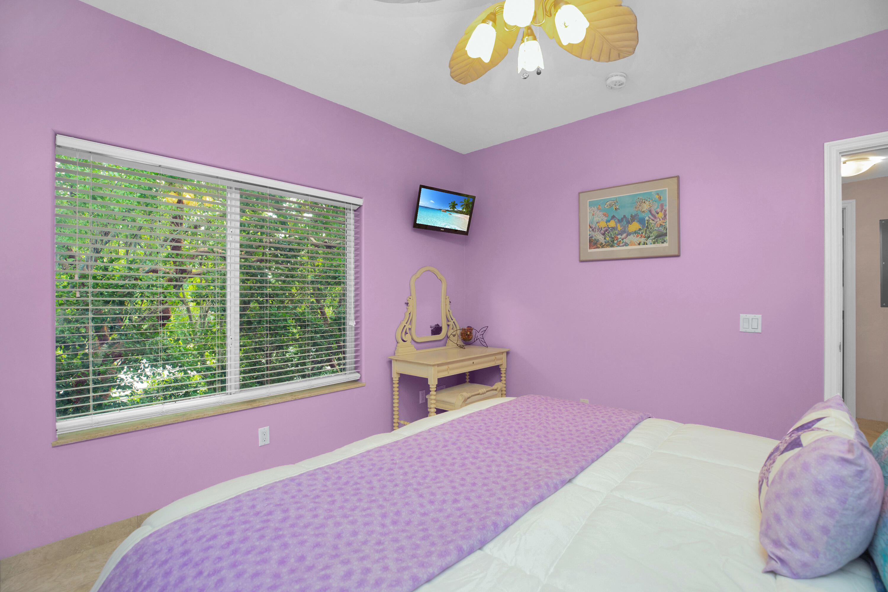 100 South Airport Road Tavernier, FL 33070 - Photo 26 of 42 a bedroom with a bed and a window