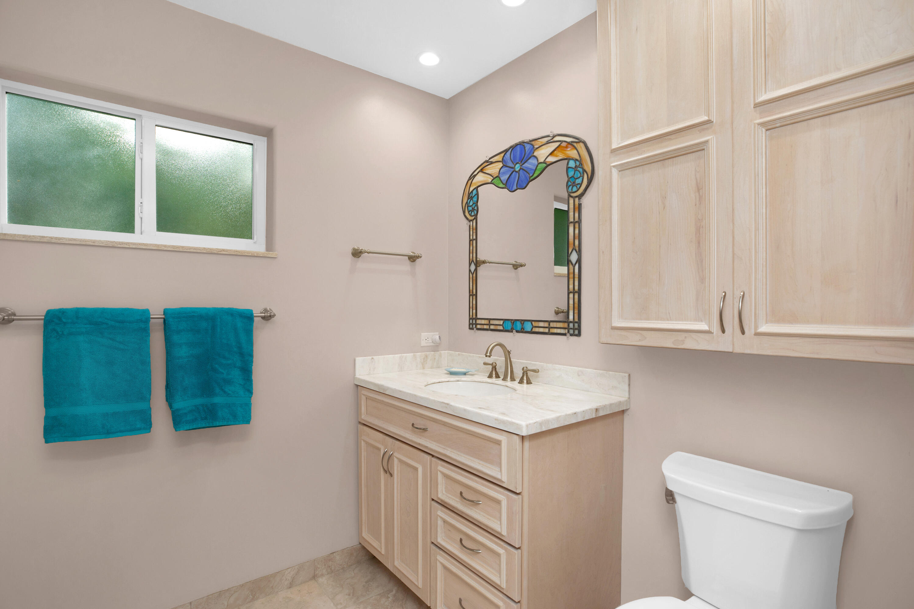 100 South Airport Road Tavernier, FL 33070 - Photo 28 of 42 a bathroom with a sink and a mirror