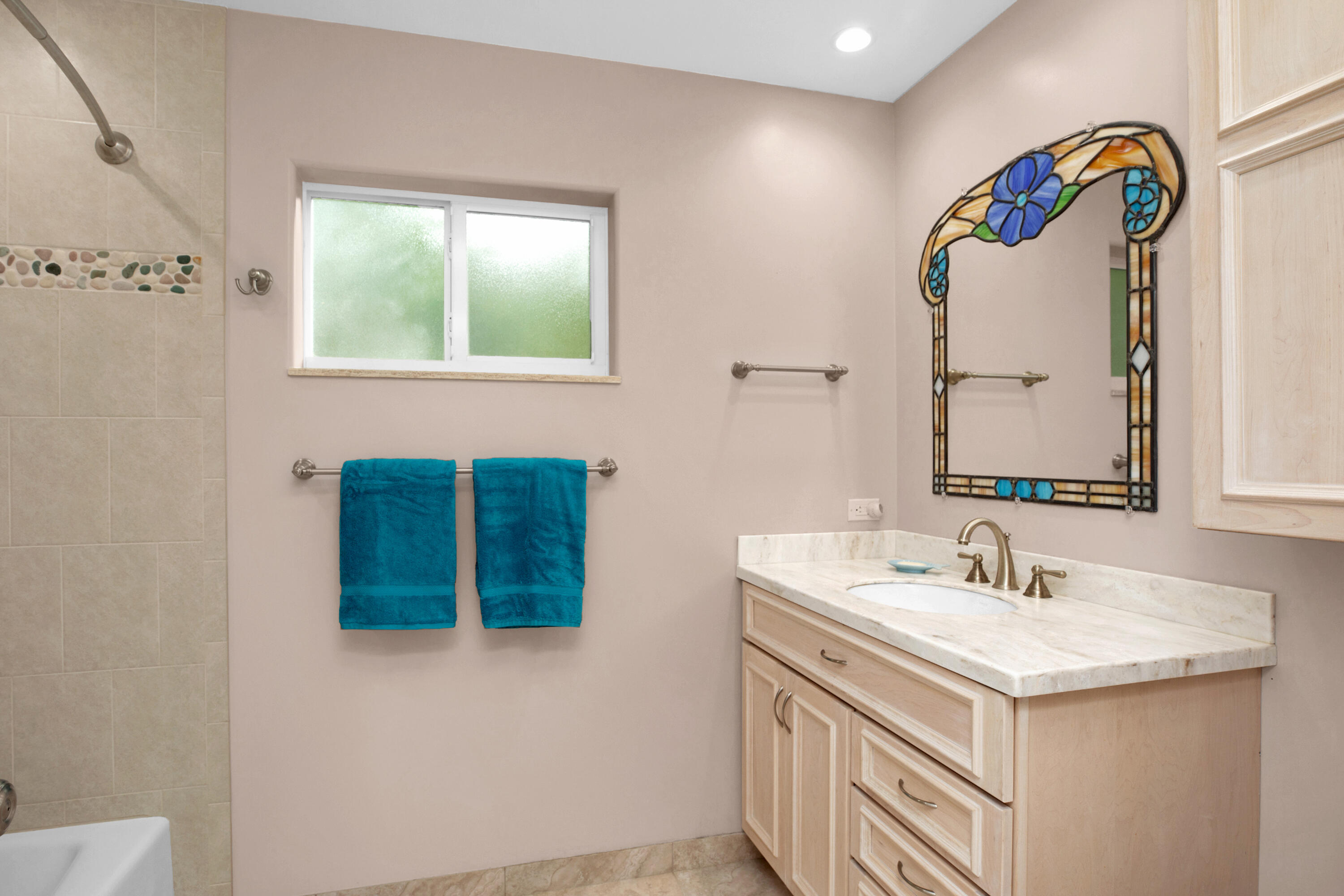 100 South Airport Road Tavernier, FL 33070 - Photo 29 of 42 a bathroom with a sink and a mirror
