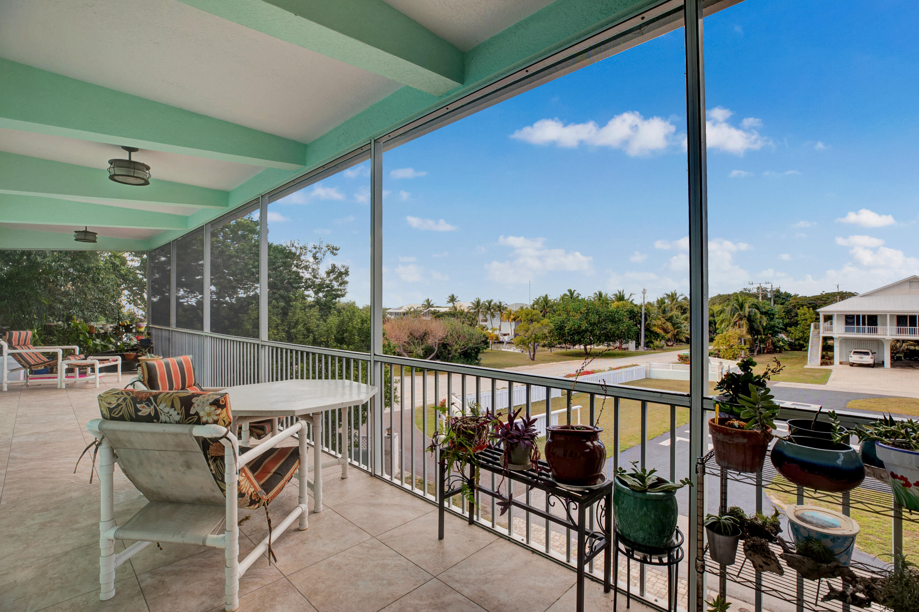 100 South Airport Road Tavernier, FL 33070 - Photo 32 of 42 a view of a chairs and table in patio